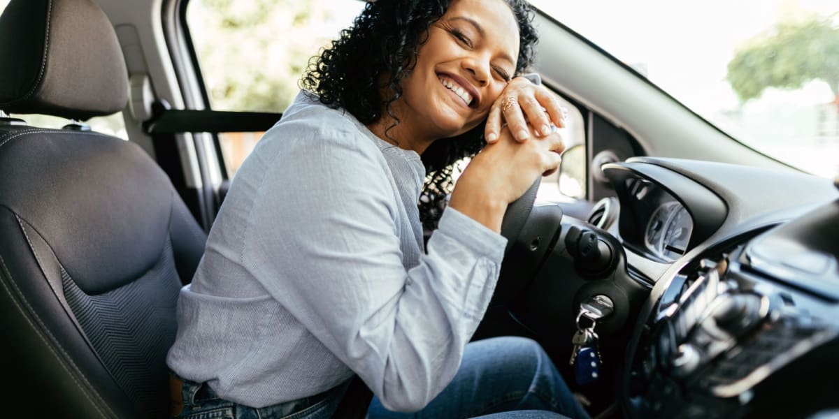 Woman happy to be driving with non-owner insurance.